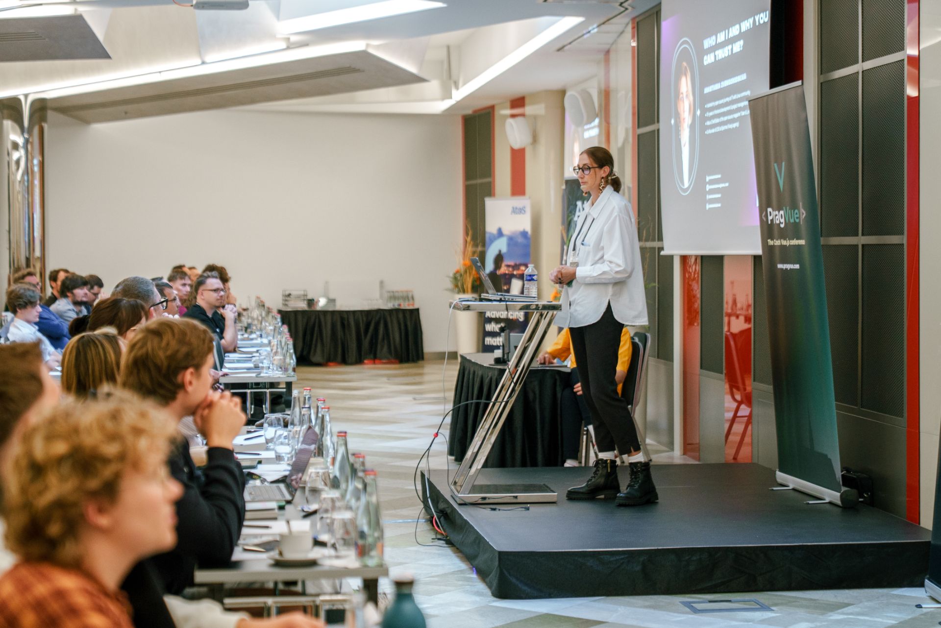 Anastasiia speaking at a conference